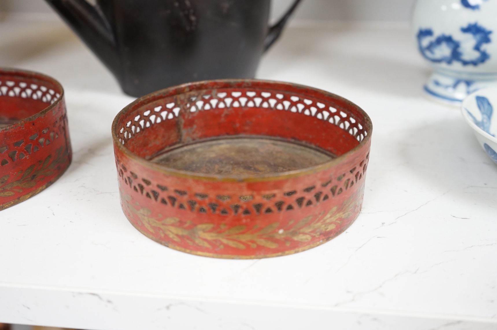 A George III silver and Old Sheffield plate mounted toleware teapot and a pair of red japanned toleware wine coasters, teapot 28cm wide (3)